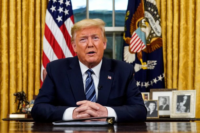 U.S. President Trump speaks about the U.S response to the COVID-19 coronavirus pandemic during an address to the nation from the Oval Office of the White House